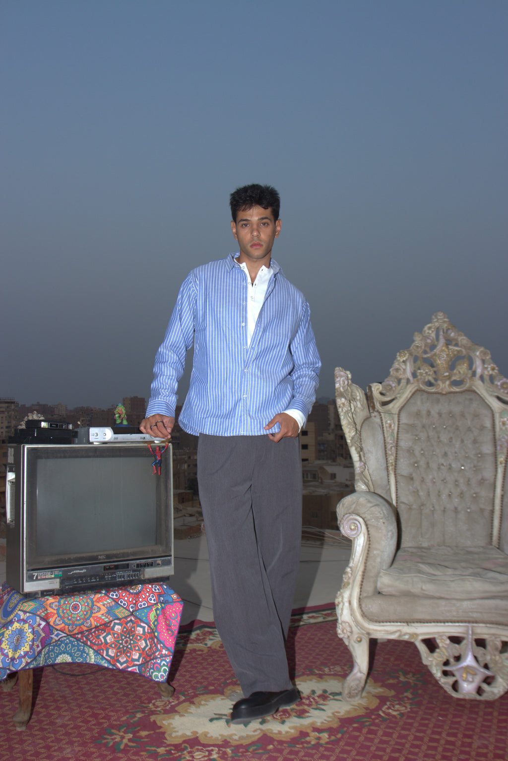 Blue shirt / Grey pants